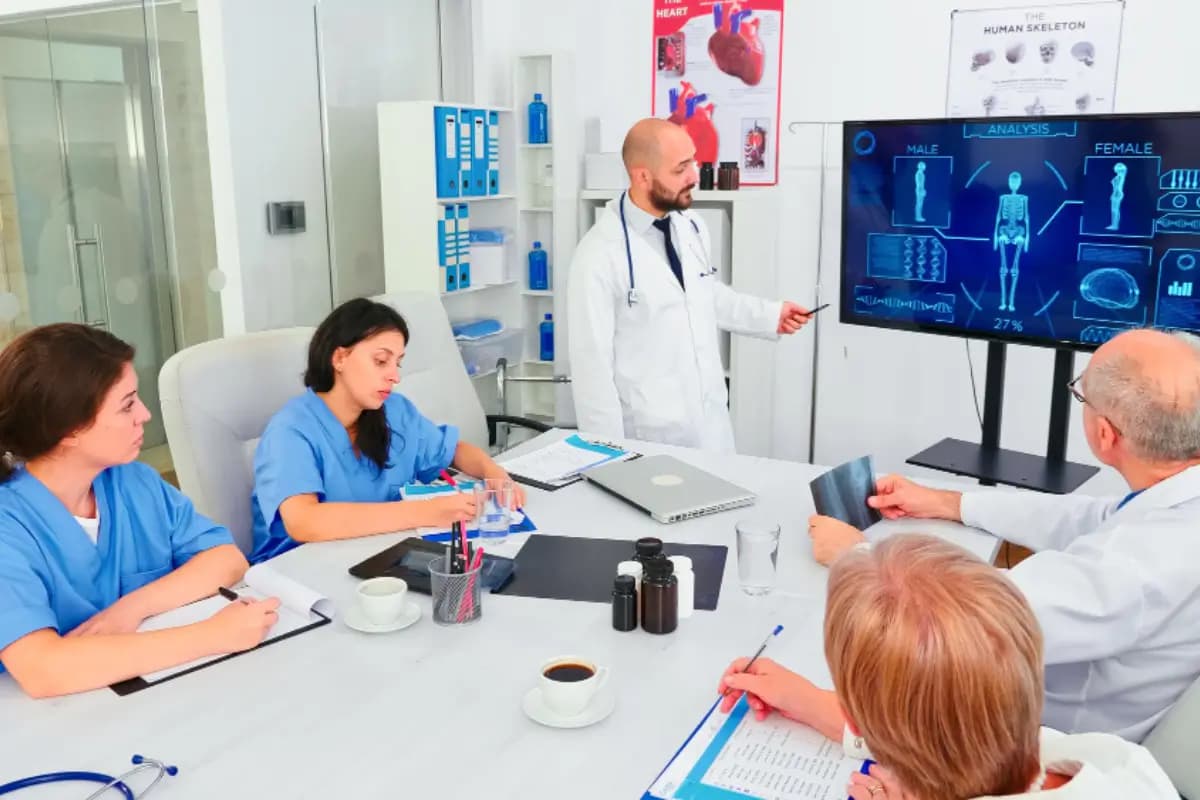 Healthcare team discussing digital tools during a training session