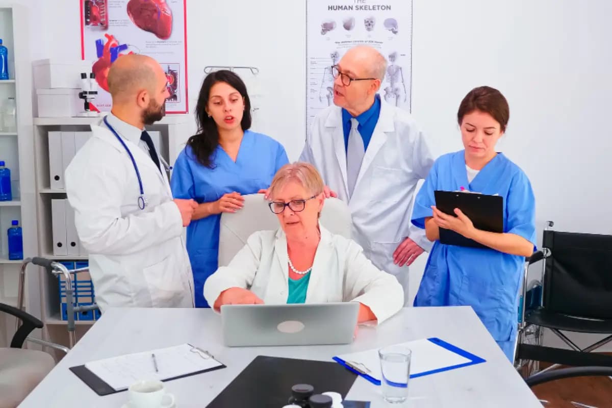 Physicians and clinical staff reviewing information together