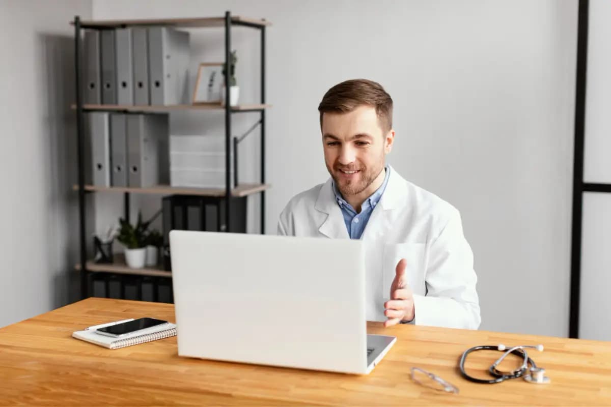 Doctor consulting remotely using a laptop